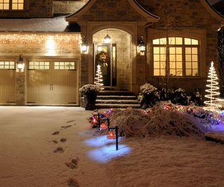 Garden path and drive with snow and lights