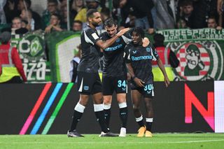 BREMEN, GERMANY - OCTOBER 26: Jeremie Frimpong of Bayer 04 Leverkusen celebrates with teammate Granit Xhaka and Jonathan Tah, after Felix Agu of Werder Bremen (not pictured) scores a own goal and Bayer 04 Leverkusen's second during the Bundesliga match between SV Werder Bremen and Bayer 04 Leverkusen at Weserstadion on October 26, 2024 in Bremen, Germany. (Photo by Stuart Franklin/Getty Images) Manchester United target