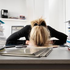 Woman with head on desk