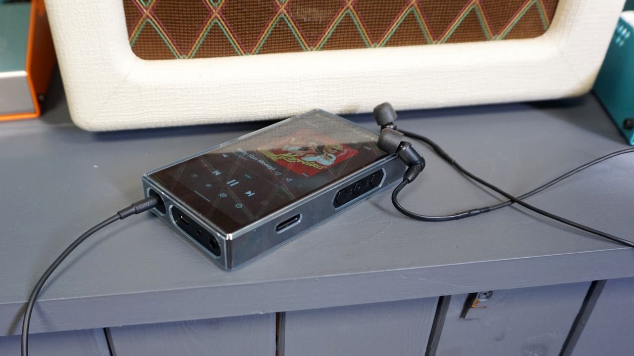 Shure AONIC 3 inserted into FiiO M11S music player
