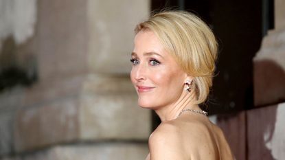 gillian anderson with hair up smiling