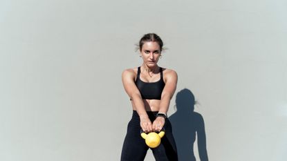 Woman holding kettlebell