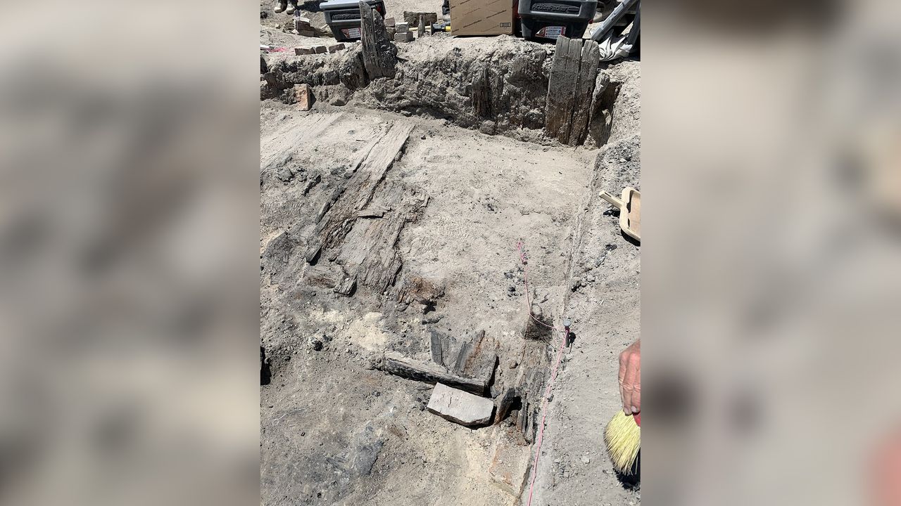 The excavation of the Chinese workers' home. Only floorboards and a few vertical posts are left behind. The boards used to construct the home were probably surplus railroad material, according to state archaeologists.