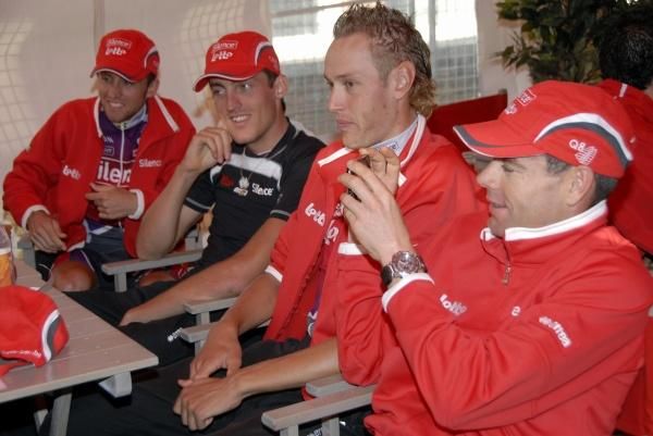 Cadel Evans (Silence-Lotto), r, takes a photo.