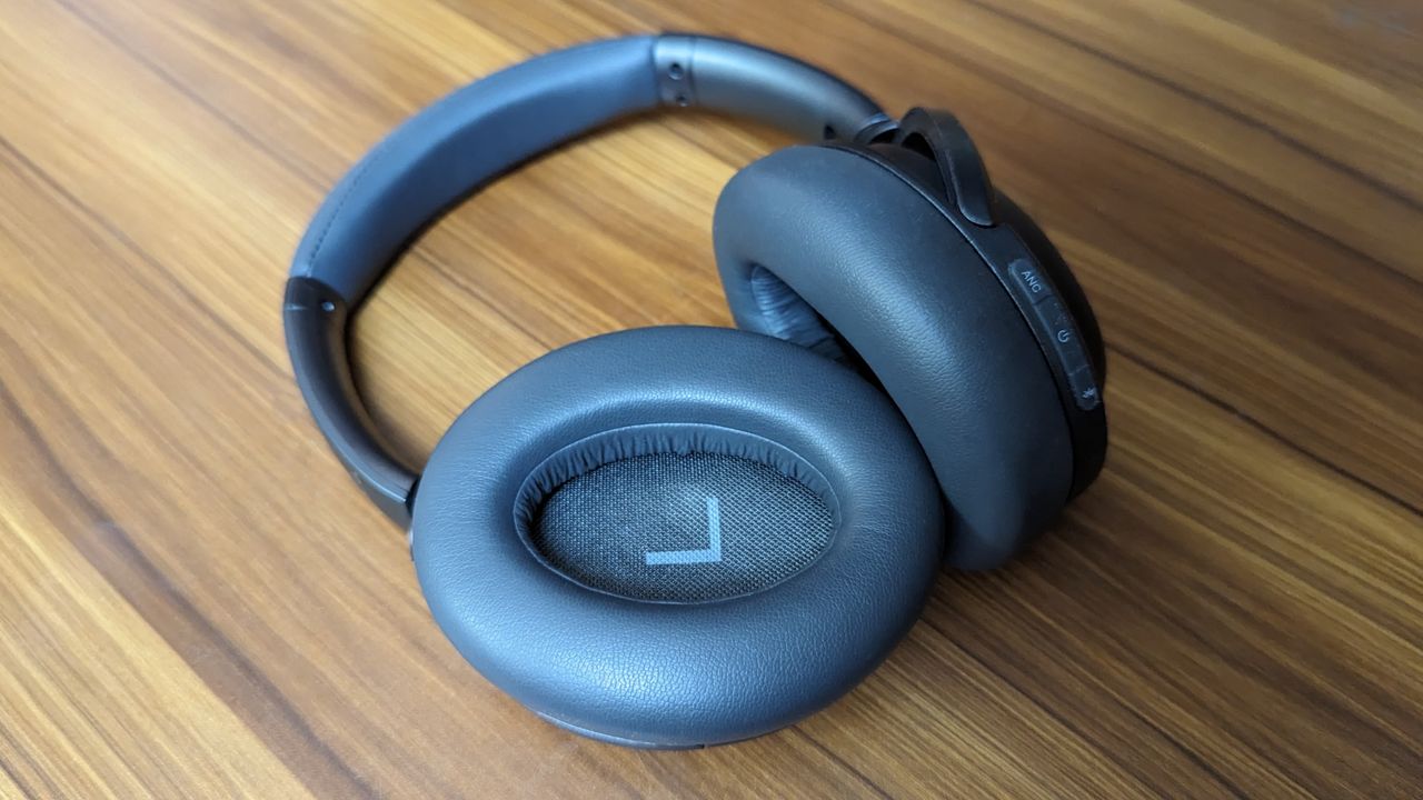 Treblab Z7 Pro wireless headphones on a wooden table.