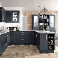 midnight blue kitchen with exposed brick walls