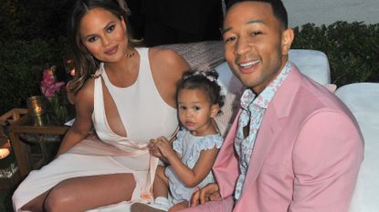 Chrissy Teigen, Luna Simone Stephens and John Legend attend John Legend's launch of his new rose wine brand, LVE, during an intimate Airbnb Concert