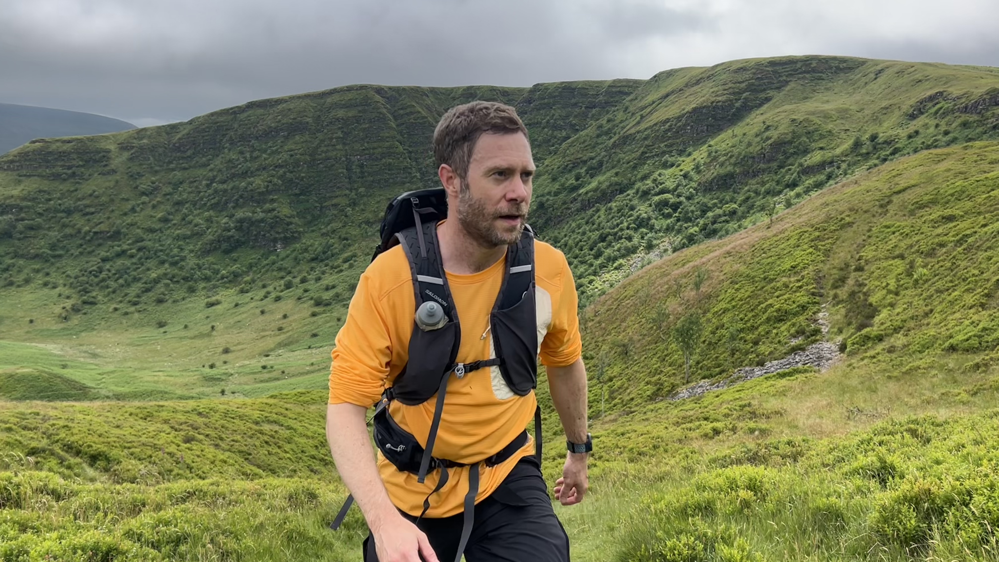 A hiker using the Salomon Aerotrek 30 in the Bannau Brycheiniog