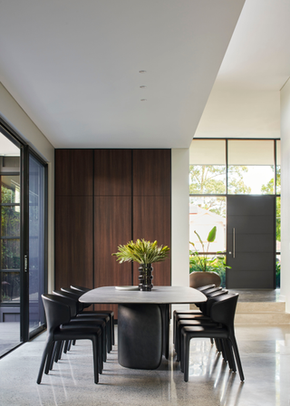 An airy dining room with a wooden dining set