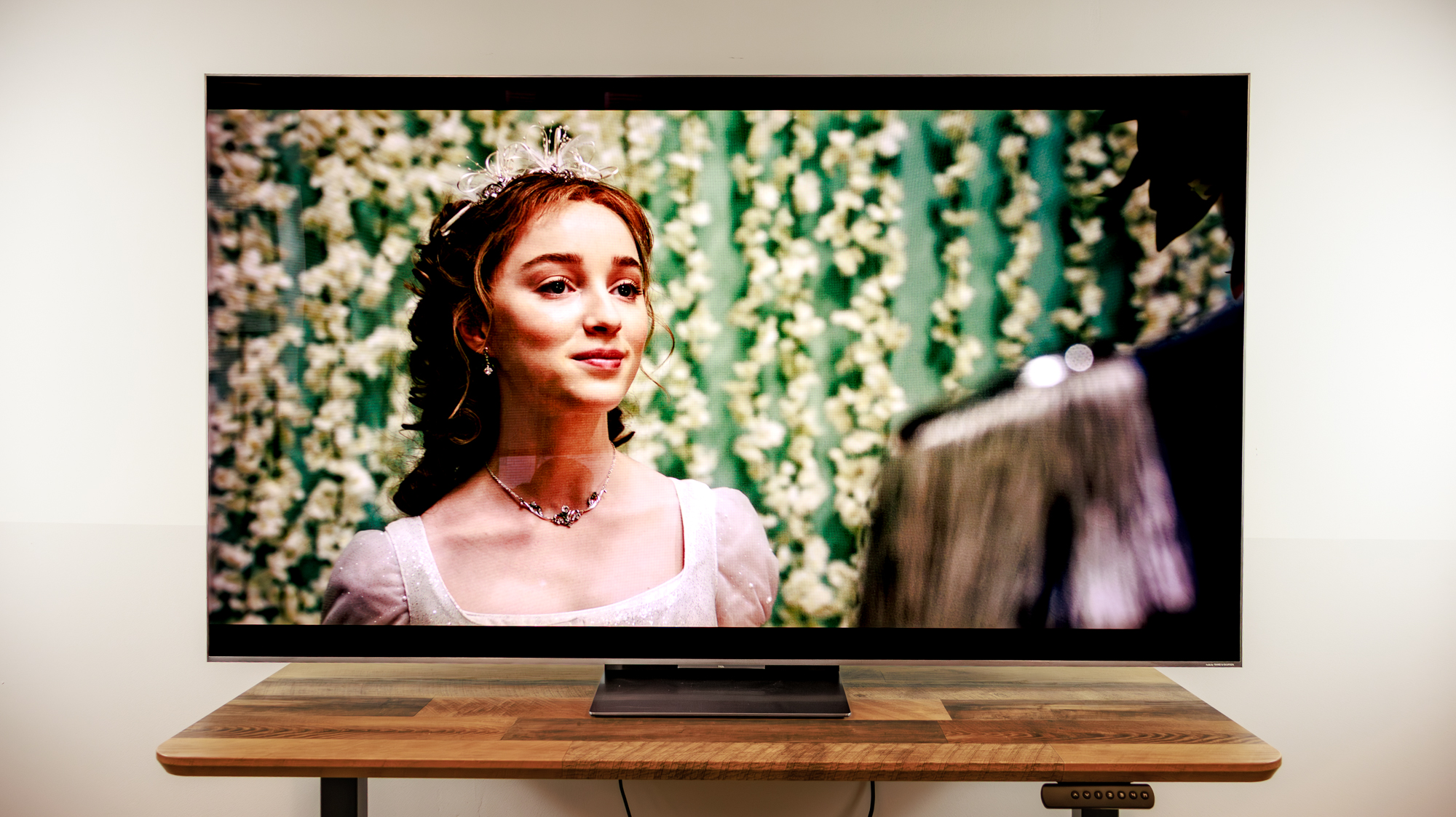 A TCL QM8L TV on a desk