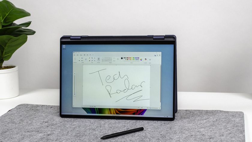 A Dell 16 Plus 2-in-1 in tent mode open to Microsoft Paint with TechRadar scribbled on a canvas
