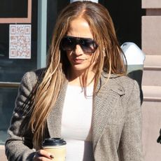 Jennifer Lopez was spotted in Beverly Hills wearing a blazer, flared jeans, brown boots, and a Herm&egrave;s croc-embossed Kelly bag