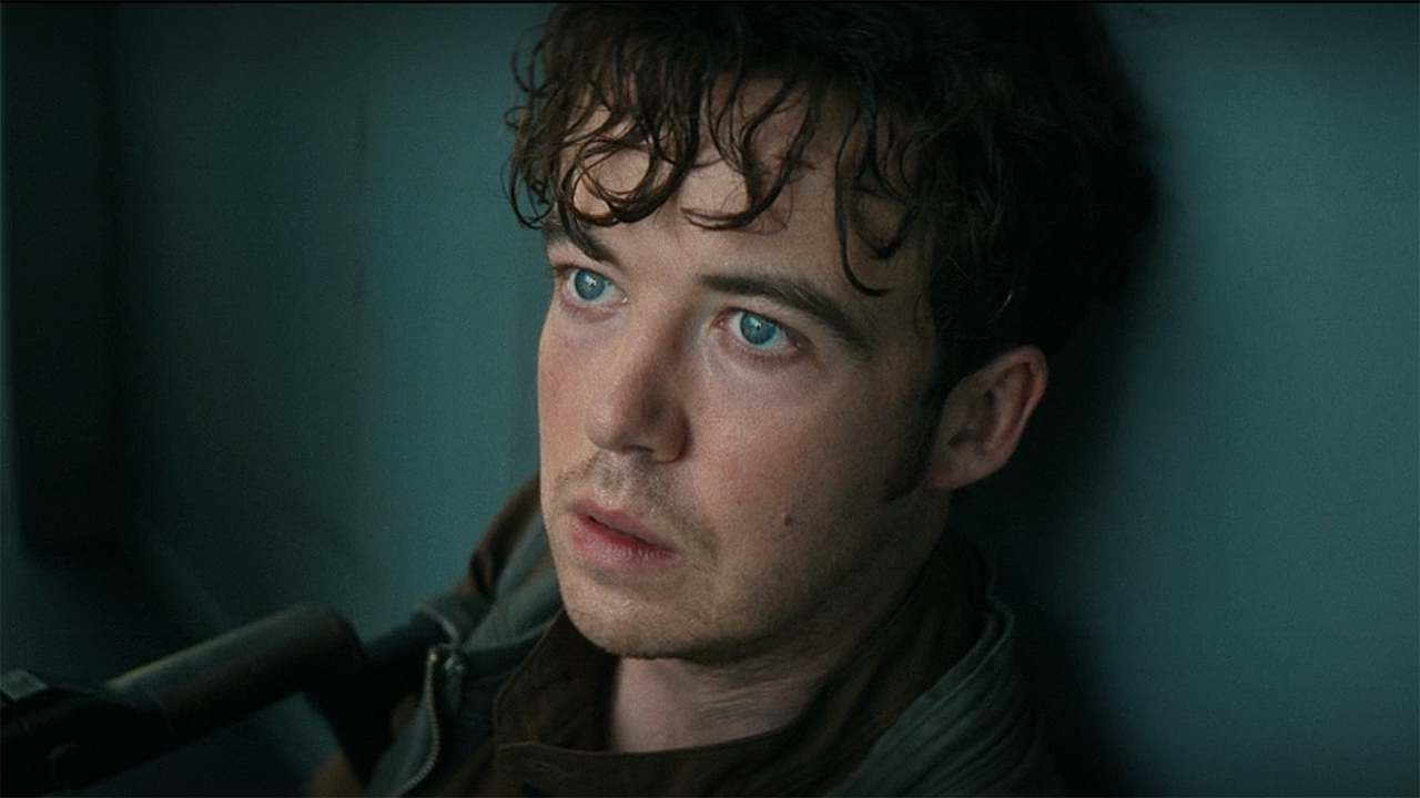 A close-up of CJ hermit sitting against a wall on a boat in Alien: Earth episode 7