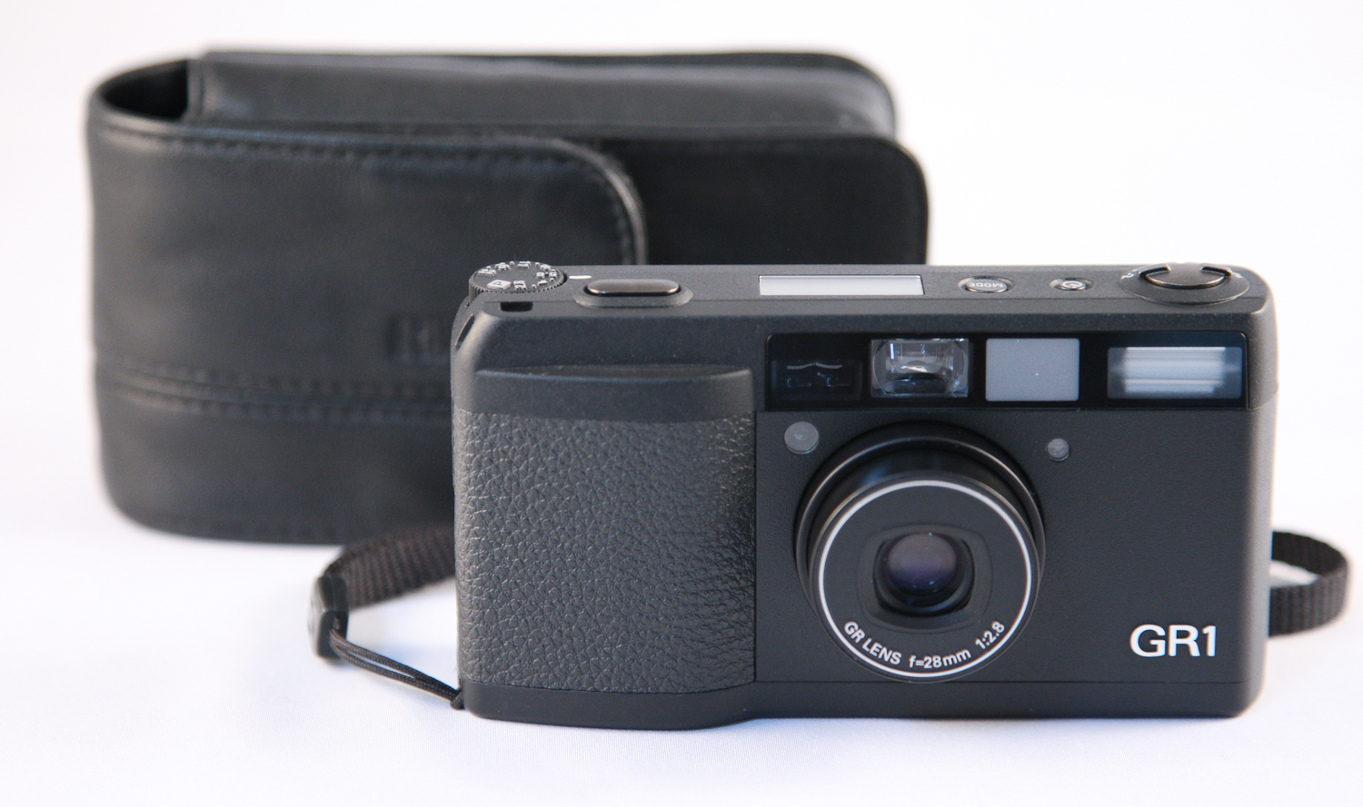 The Ricoh GR1 35mm compact film camera with a case on a white background