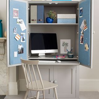 home office with grey cupboard computer and chair