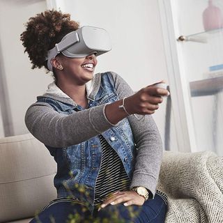 Woman uses Oculus Go while sitting