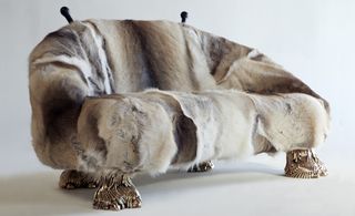 'Unique Beast' sofa with Finnish Reindeer fur and carved wooden horns