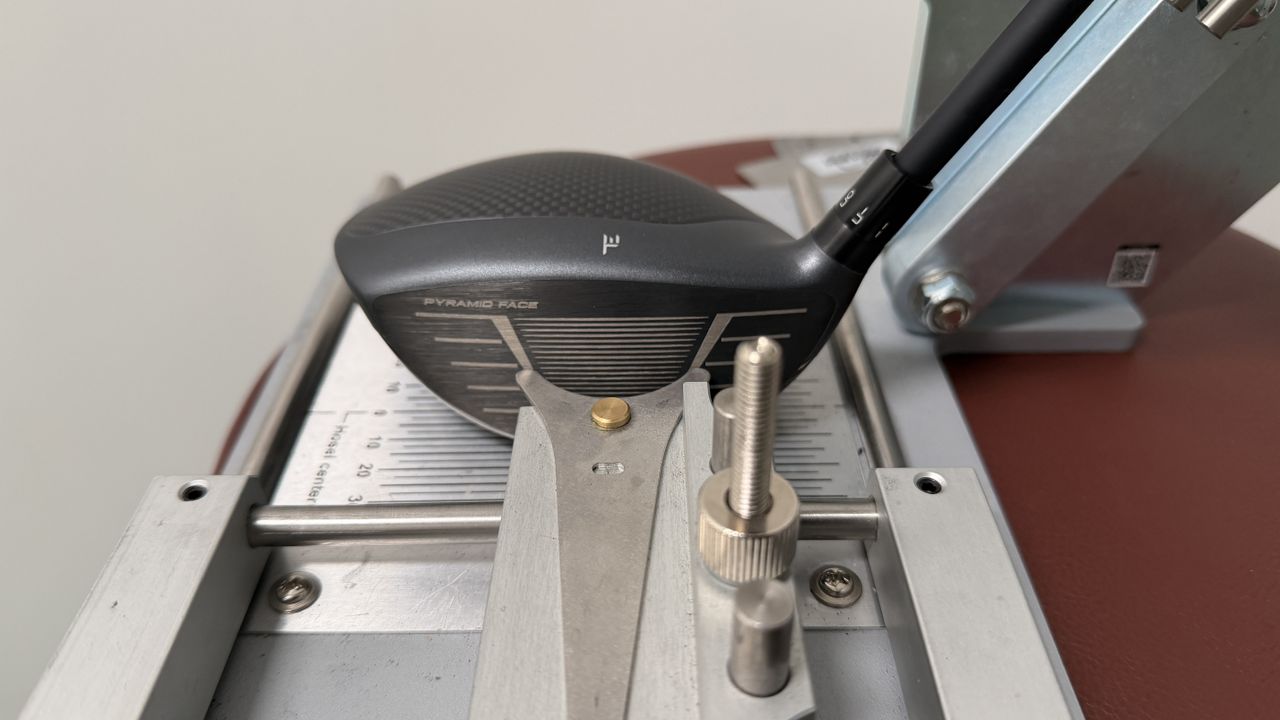 Photo of the Tour Edge Exotics Mini Driver in a driver loft and lie machine