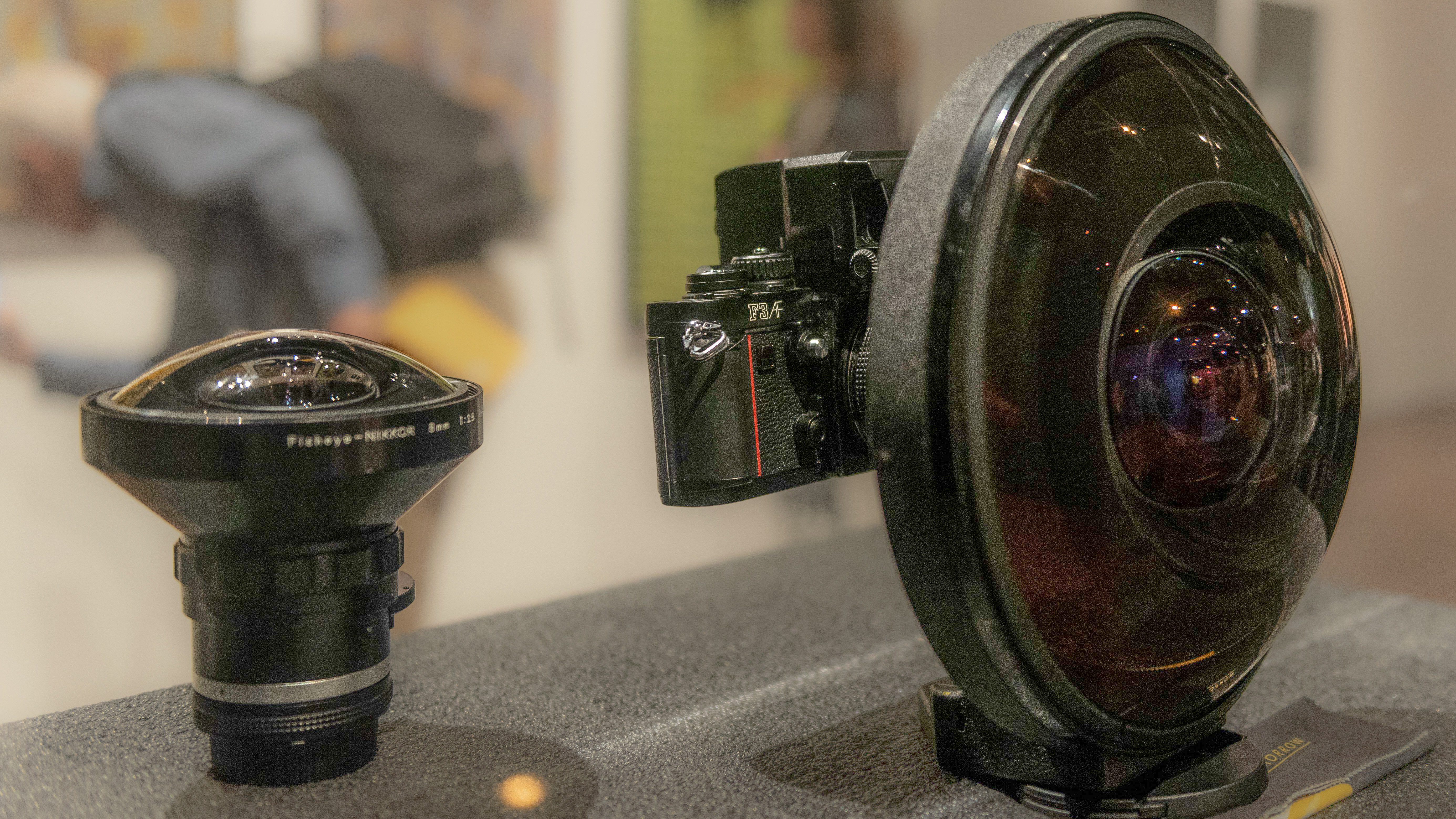 2GJM2FM London, UK. 10 September 2021. (L to R) A Nikon 8mm fisheye lens and a Nikon 6mm fisheye lens on display at Photo London at Somerset House. Credit: Stephen Chung / Alamy Live News