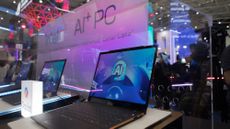 AI-equipped laptops are displayed at the MSI booth during Computex 2024