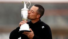 Xander Schauffele kissing the claret jug in after his 2024 British Open win