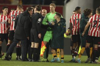 Frank (left) argued with Wolves players after Brentford suffered another Premier League defeat.