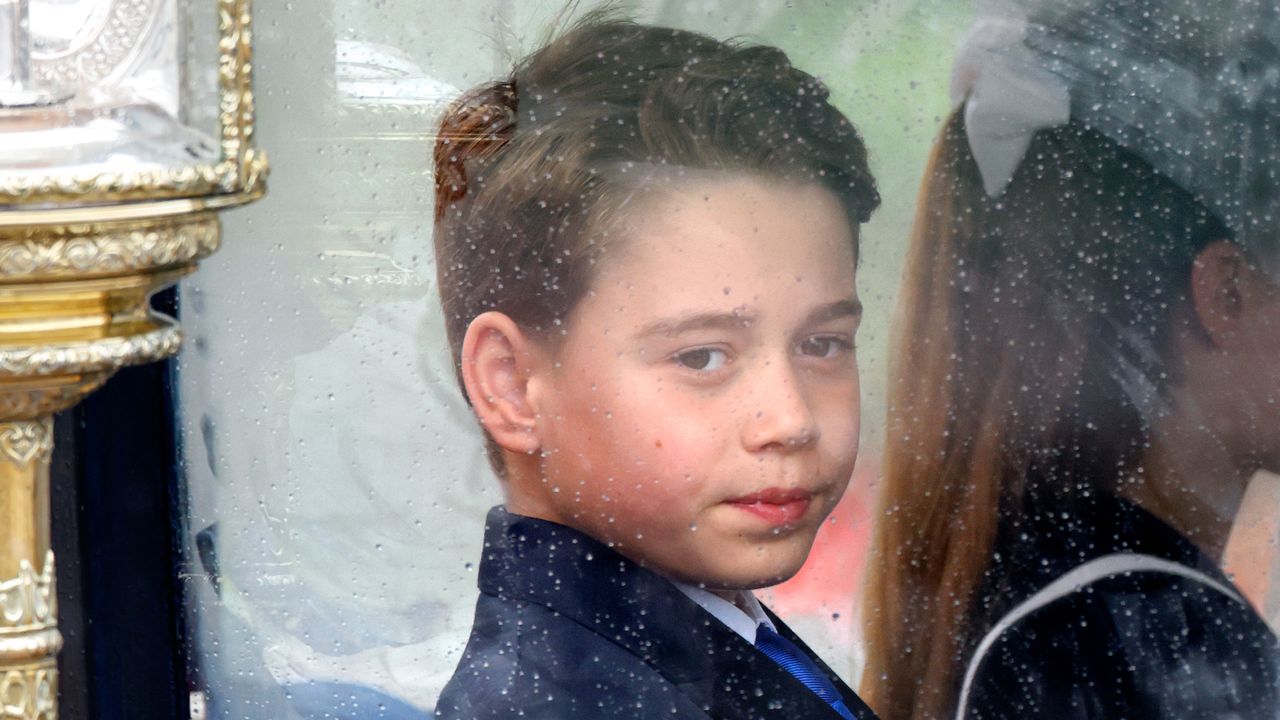 Prince George riding in a carriage next to Princess Charlotte at Trooping the Colour 2024