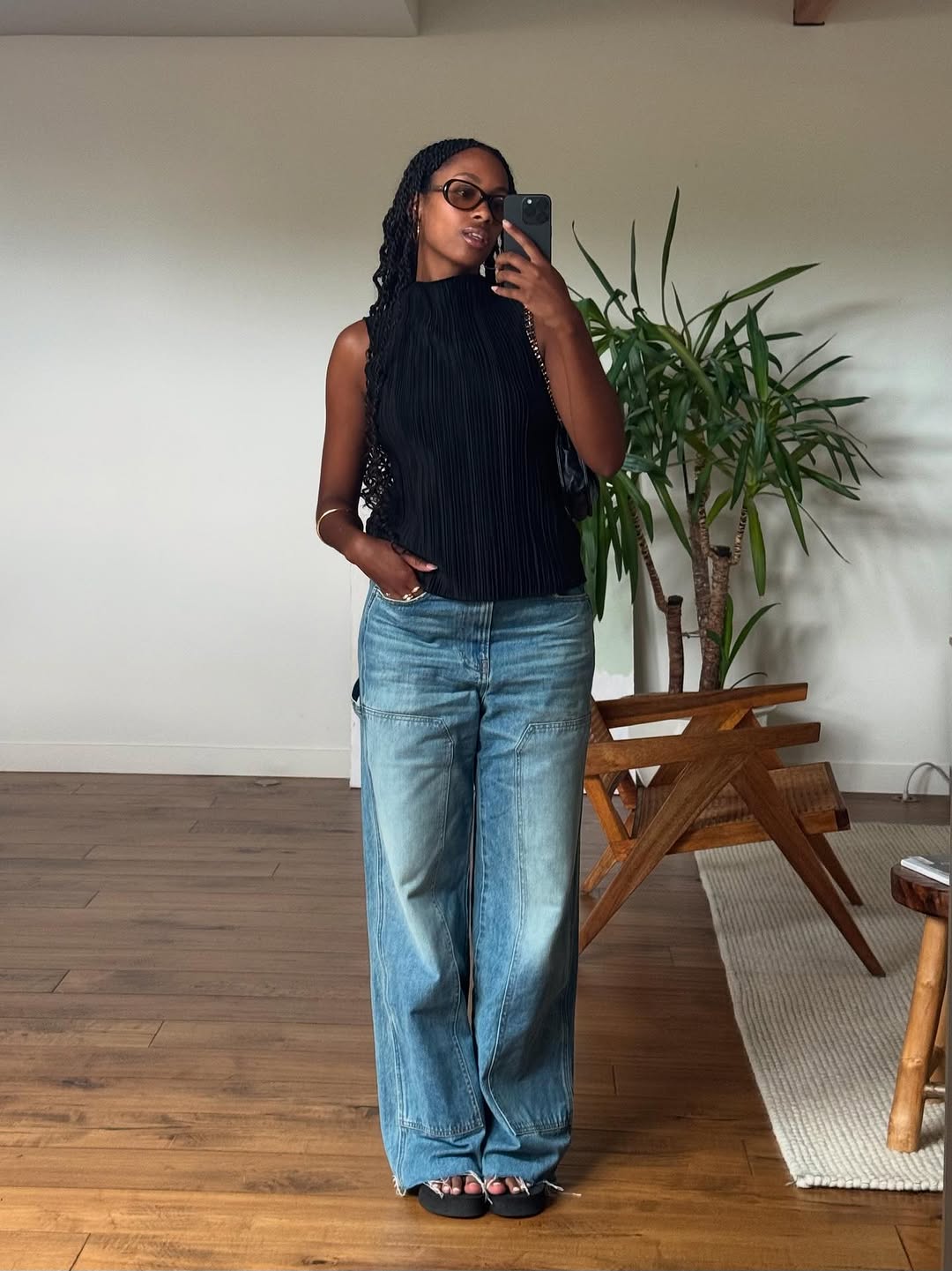 woman wearing dirty denim wash jeans fall denim trend 2025