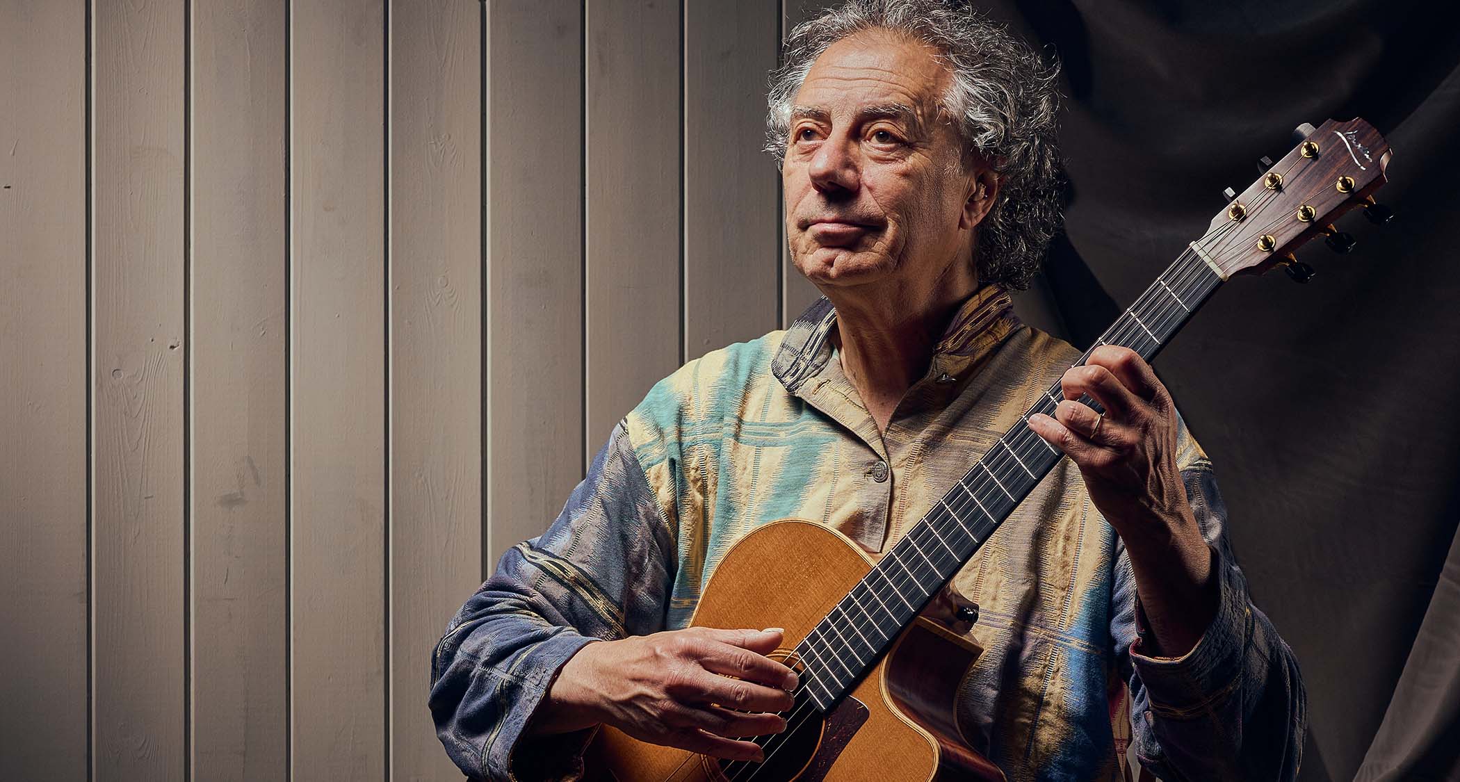 Pierre Bensusan is photographed with his beloved Lowden acoustic