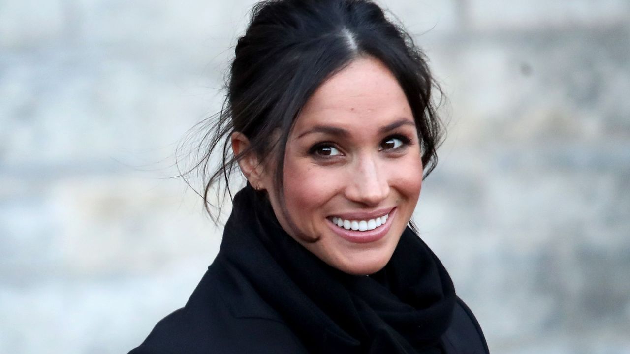 meghan markle flashing a smile