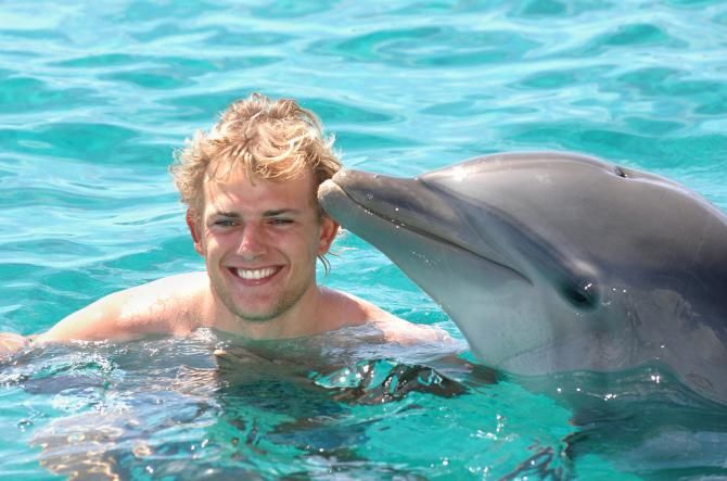 Gerald Ciolek with a dolphin