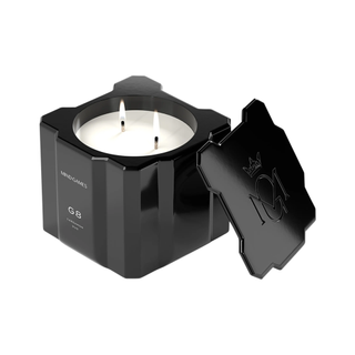 candle in a geometric black vessel