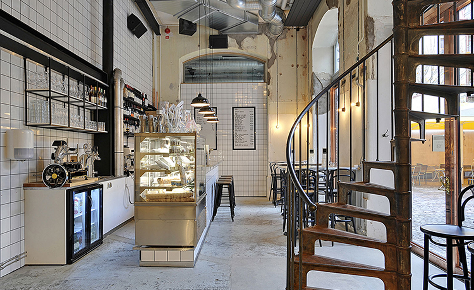 Interior design with glass cabinet, seating and stairs