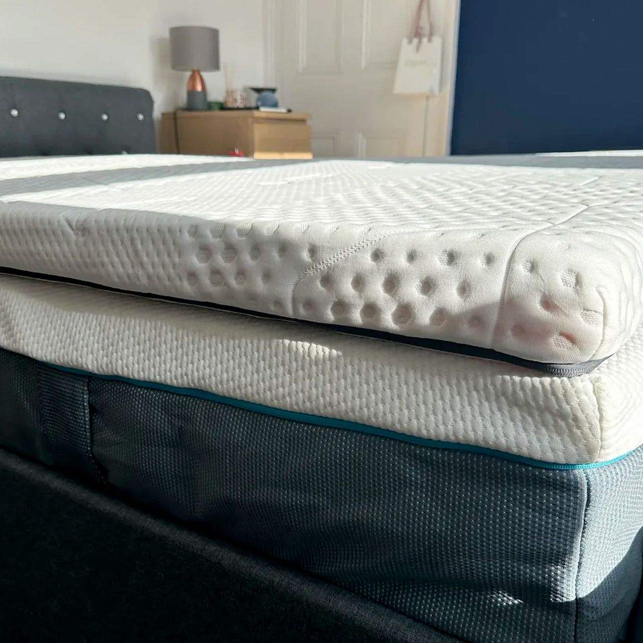 A side view of the Emma Premium mattress topper