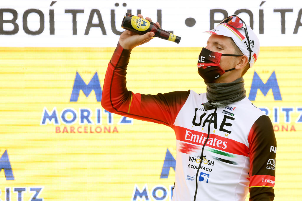 BO TALL SPAIN MARCH 24 Joo Almeida of Portugal and UAE Team Emirates celebrates winning the stage on the podium ceremony after the 101st Volta Ciclista a Catalunya 2022 Stage 4 a 1665km stage from La Seu dUrgell to Bo Tall 2015m VoltaCatalunya101 WorldTour on March 24 2022 in Bo Tall Spain Photo by David RamosGetty Images