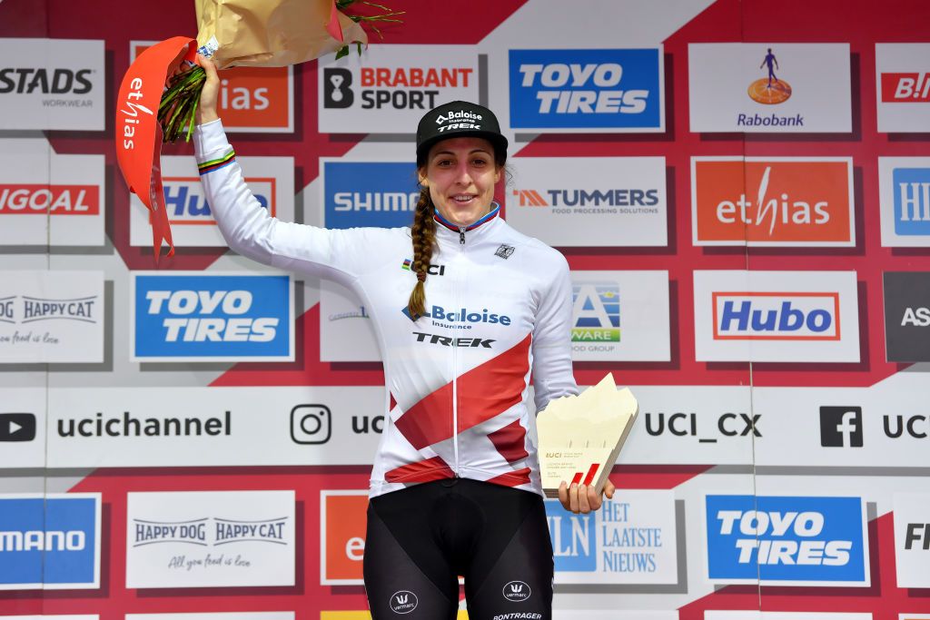 HOOGERHEIDE NETHERLANDS JANUARY 23 Lucinda Brand of The Netherland and Team Baloise Trek Lions celebrates winning the UCI WorldTour Leader Jersey on the podium ceremony after the 32nd GP Adrie Van der Poel Hoogerheide UCI CycloCross Worldcup 2022 Womens Elite CXWorldCup on January 23 2022 in Hoogerheide Netherlands Photo by Luc ClaessenGetty Images