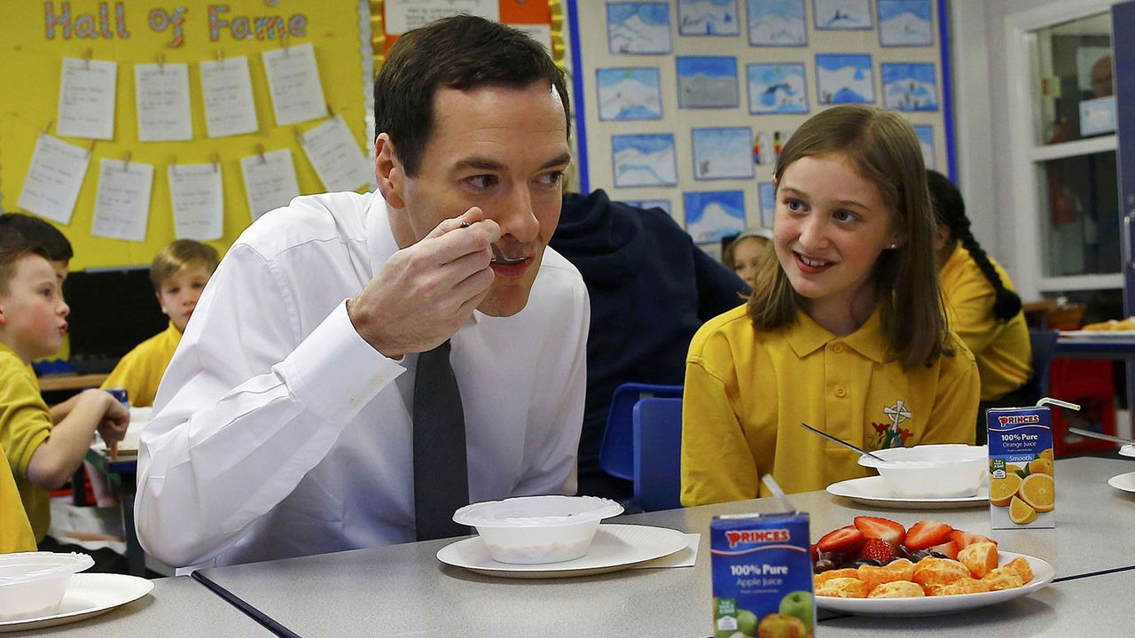 George Osborne combined two risky activities - eating and meeting children - at St Benedict's in Garforth last year