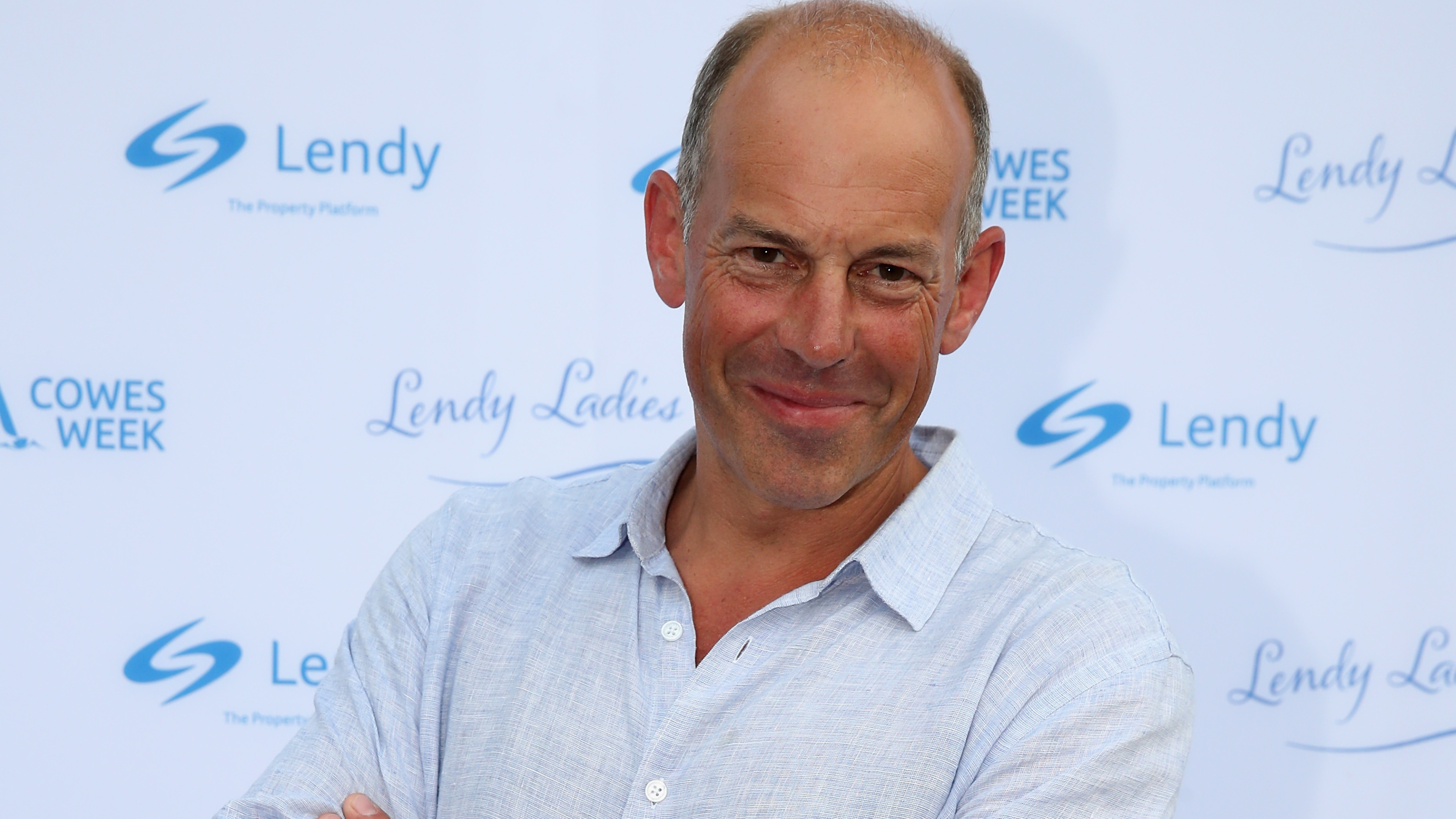 Phil Spencer wearing a blue shirt on the red carpet.