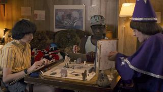 Mike, Lucas, and Will playing Dungeons and Dragons in Stranger Things season 1