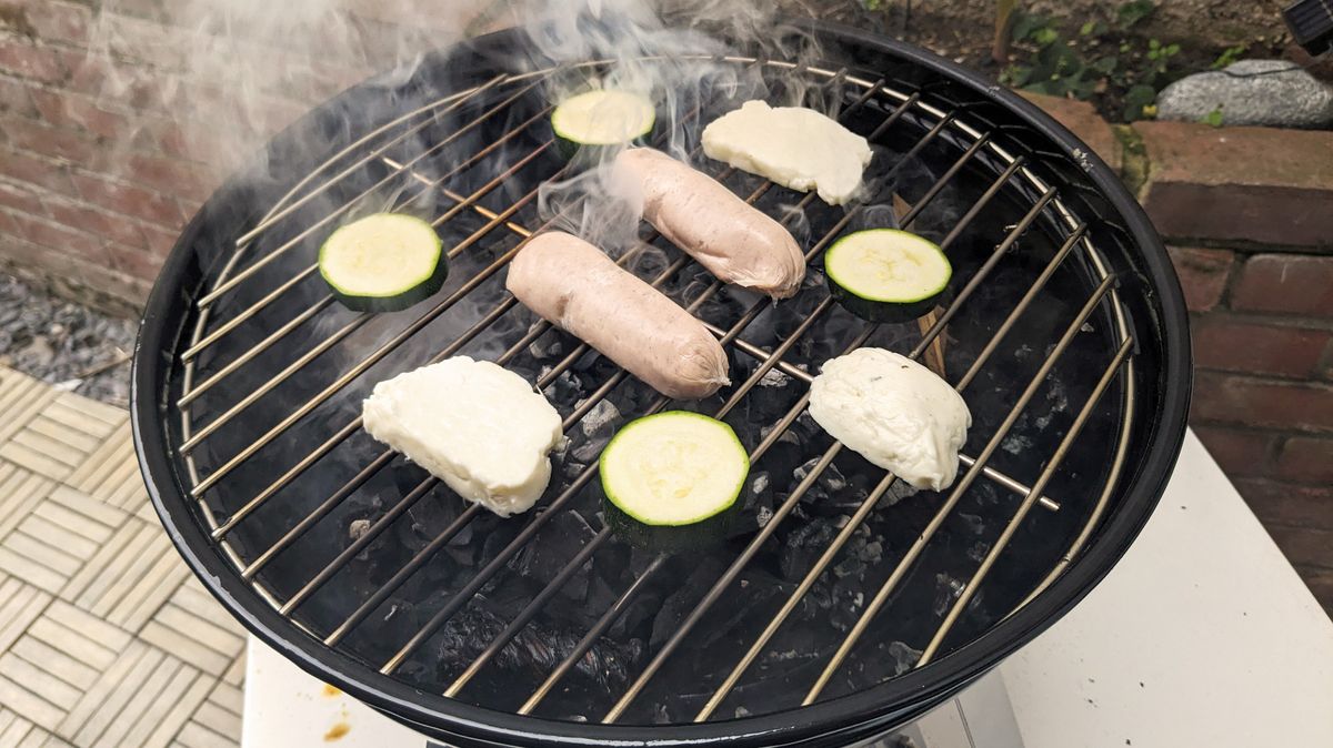 Napoleon NK14 Portable Charcoal Kettle Grill being tested in writer's home