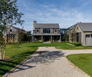 The exterior of a wood and stone house in the mountains