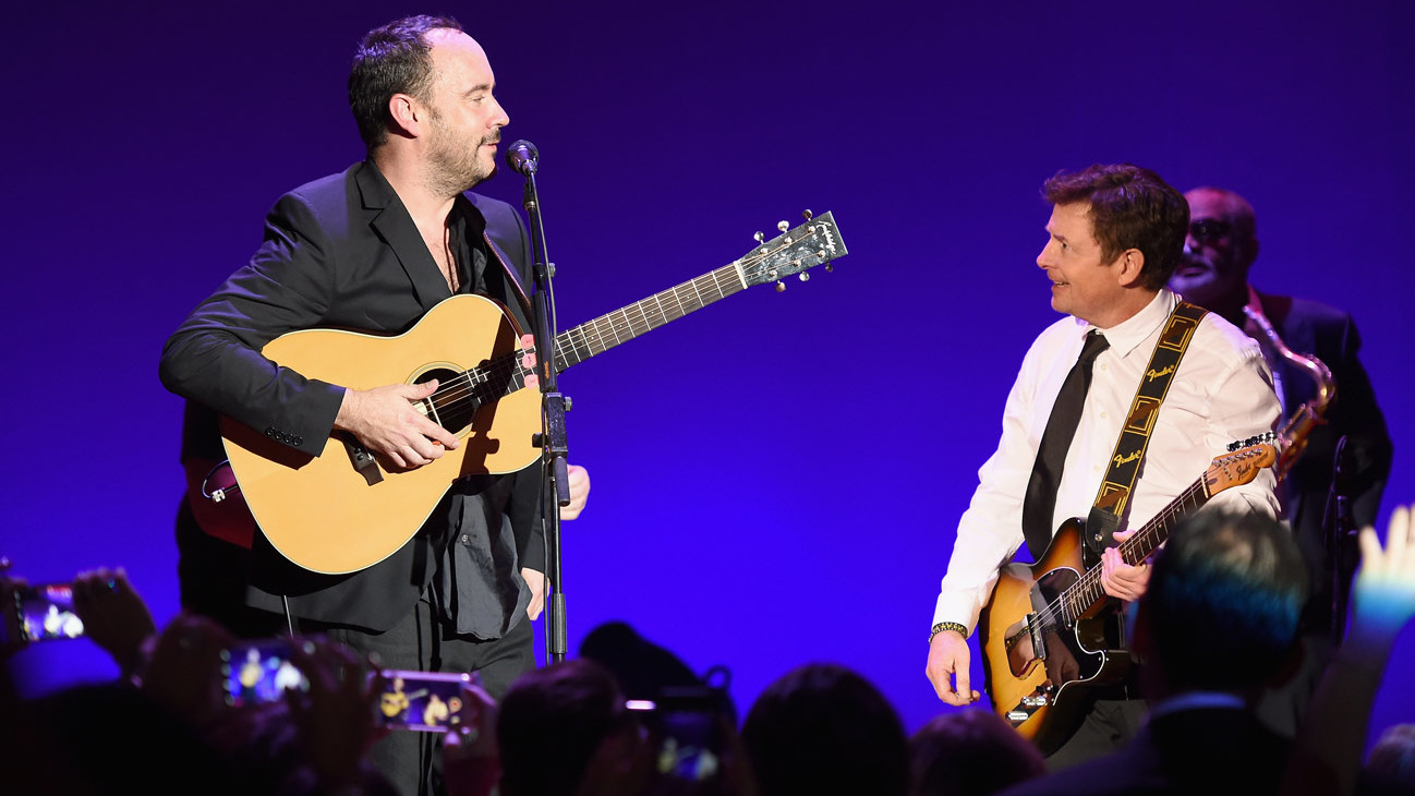 A picture of Dave Matthews and Michael J Fox on stage in New York