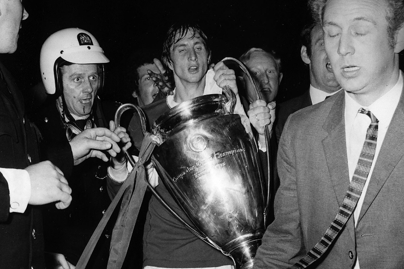 Johan Cruyff, wearing a Panathinaikos shirt, celebrates Ajax's European Cup final win over the Greek side at Wembley in June 1971.