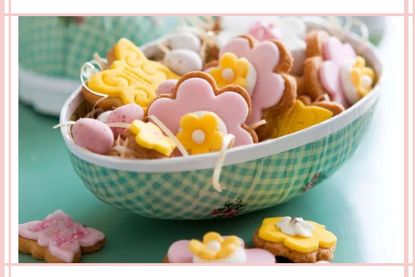 A basket of floral Easter biscuits pink and yellow