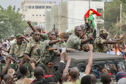 Malian soliders celebrate after apparent coup
