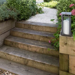 wooden steps and candle in garden