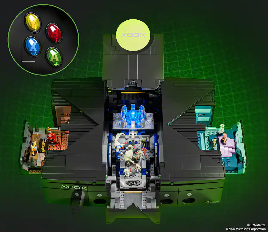 Mattel Brick Shop original Xbox model opened to show Halo, Fable, and Psychonauts dioramas, with close-up Xbox controller buttons and a green grid background.