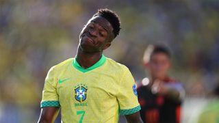 Brazil's Vinicius Junior tilts his head reacting to the crowd at his team's Copa America 2024 match against Colombia.