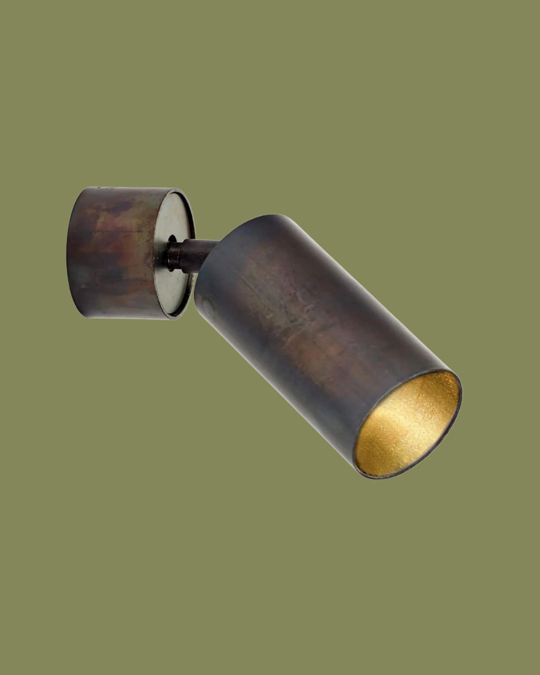 Serax Sofisticato Wall Spotlight against dark green background.
