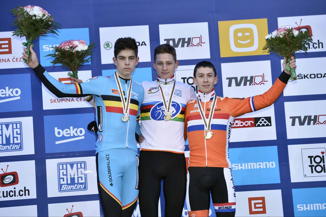 Mathieu van der Poel in the rainbow jersey flanked by Wout Van Aert and Lars van der Haar.